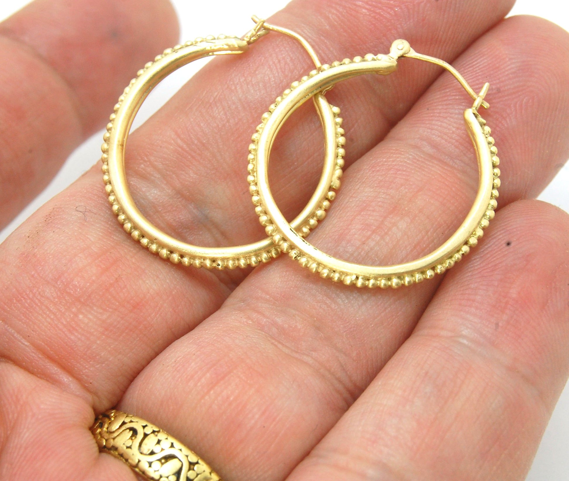 Etruscan hoops in 14k Gold - Large-SQ6408116 These 14k yellow gold hoops are cast in my studio (actually on the deck as casting needs good ventilation) from a granulated master for a limited edition series of hoops. I use fine silver for the original gran