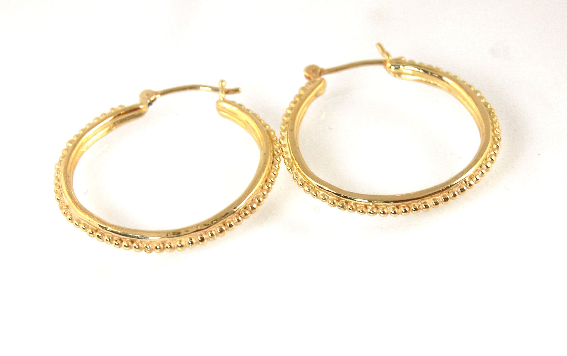 Etruscan hoops in 14k Gold - Large-SQ6408116 These 14k yellow gold hoops are cast in my studio (actually on the deck as casting needs good ventilation) from a granulated master for a limited edition series of hoops. I use fine silver for the original gran