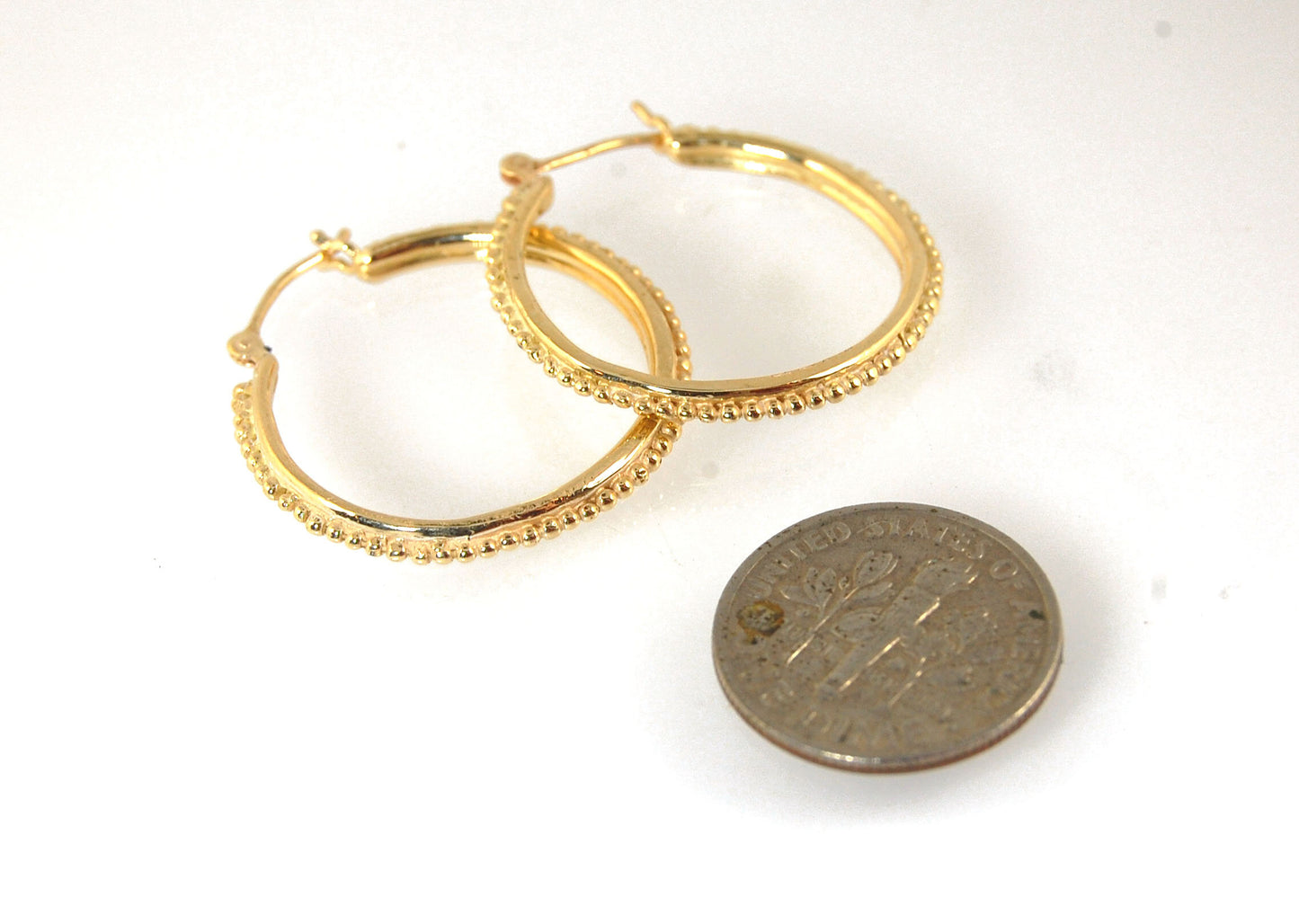 Etruscan hoops in 14k Gold - Large-SQ6408116 These 14k yellow gold hoops are cast in my studio (actually on the deck as casting needs good ventilation) from a granulated master for a limited edition series of hoops. I use fine silver for the original gran