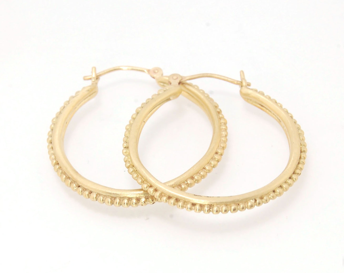 Etruscan hoops in 14k Gold - Large-SQ6408116 These 14k yellow gold hoops are cast in my studio (actually on the deck as casting needs good ventilation) from a granulated master for a limited edition series of hoops. I use fine silver for the original gran