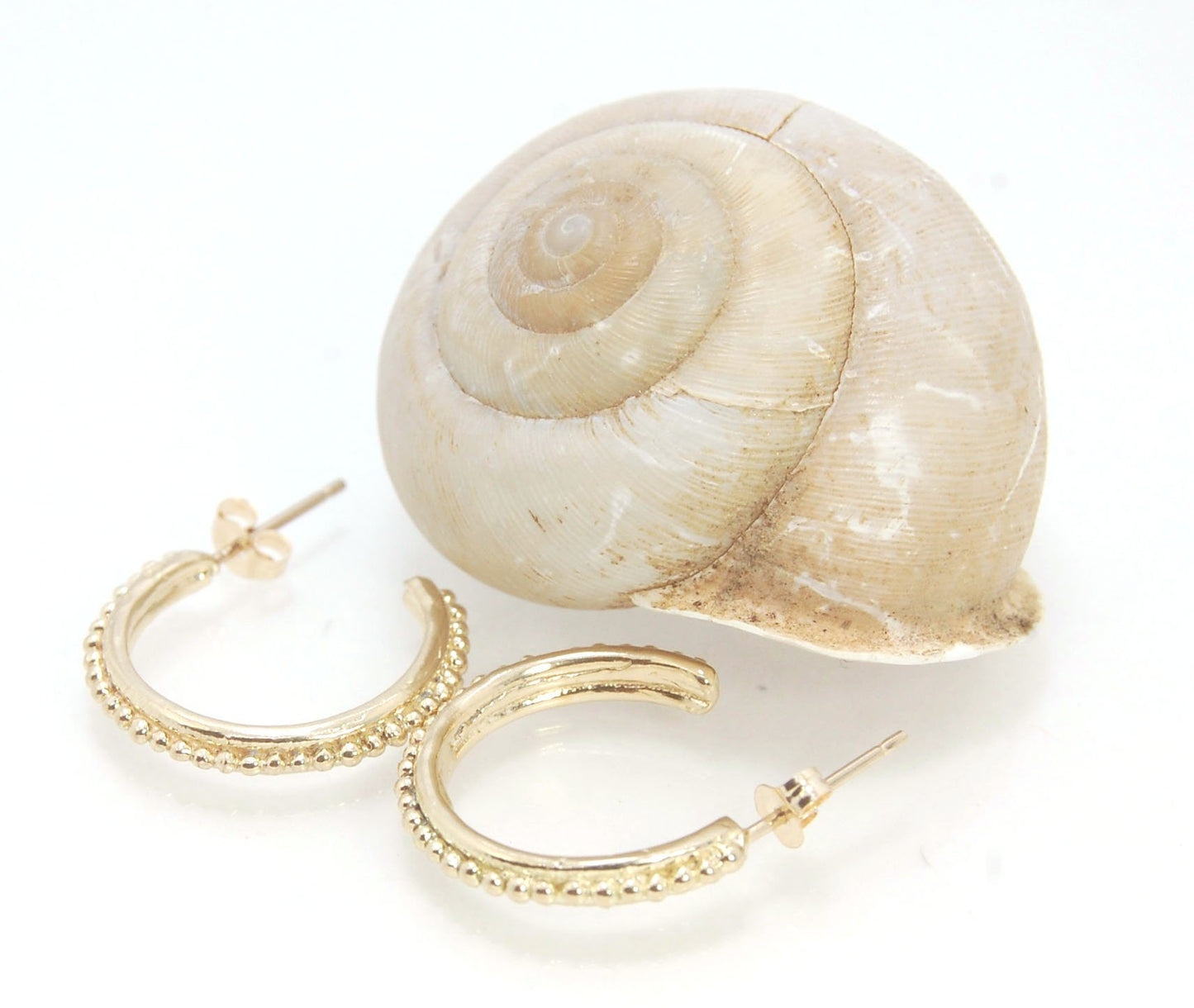 Etruscan hoop posts in 14k Gold - Medium-SQ5258500 These 14k yellow gold hoops are cast in my studio from a granulated master for a limited edition series of hoops. I use fine silver for the original granulation, then make a mold, pull a wax copy from the