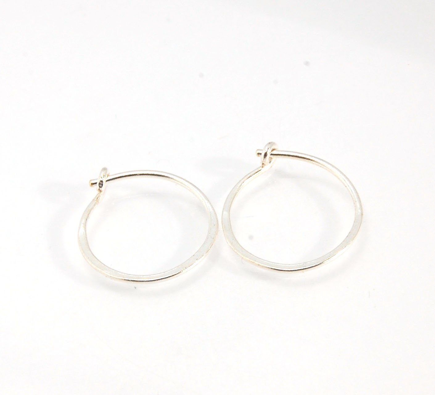 Hammered Hoops - Sterling - Small, Medium and Large Looking for an affordable handmade gift? Or some super lightweight Sterling Silver Hoops you can live in? These classic wire hammered hoops you can sleep and live in are forged from 20 gage Sterling wire