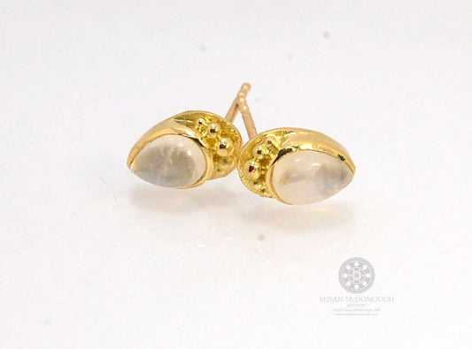 Rainbow Moonstone in 18k Granulation post earrings These sweet rainbow moonstone cabochons are bezel-set in 18k gold with 18k granulation around the outside. These are 18k gold post earrings with a 14k gold ear nut as well as a soft plastic ear nut so you