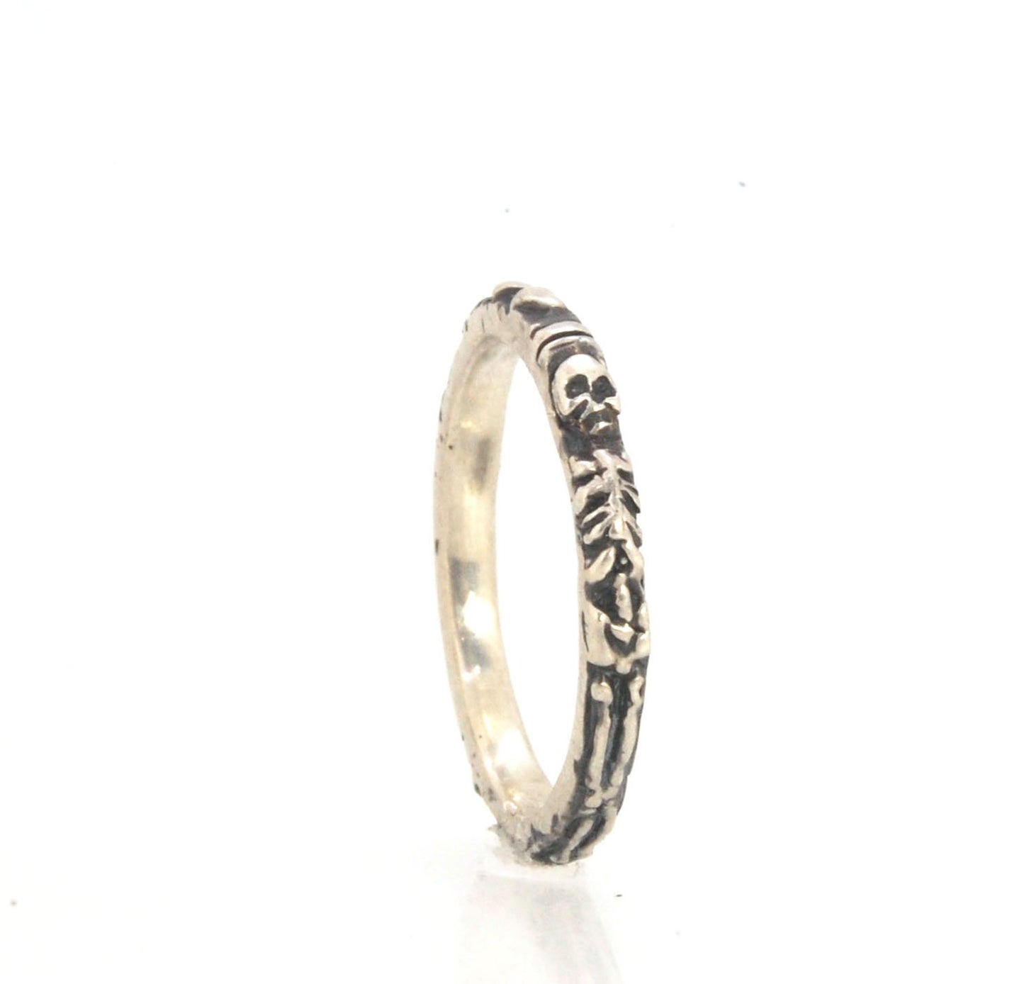 Oxidized Memento Mori Skeleton Ring - 2.7mm - Sterling Silver This is the most narrow of my Memento Mori Skeleton rings at 2.7mm wide! The Skeleton is flanked by crossed bones on one side and intertwined hearts and an hourglass on the other. This is the 4
