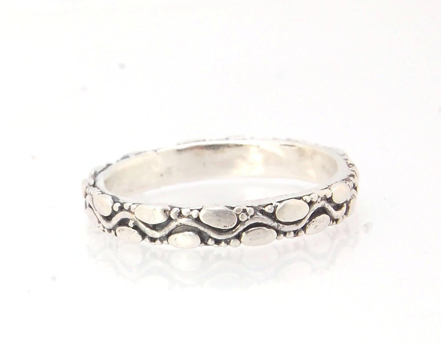 Ovals Pattern Band -3mm- Order in any size -14k, 18k, FS or Sterling This is a 3mm patterned band with small oval and small granules around a wavy center line. This is a cast version of a striking and fun band I originally made in fine silver using the pr
