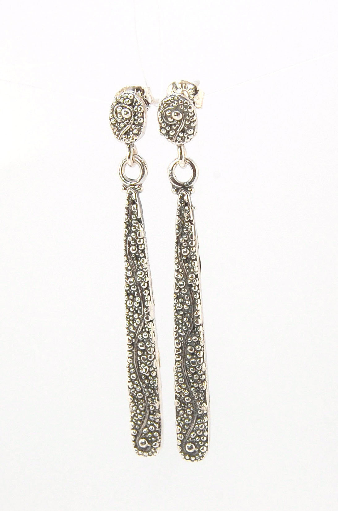 Seaweed Long Dangle Post Earrings These seaweed Post dangle earrings are cast versions of my original granulation work. Once the original work is made using the ancient technique of granulation, it is then molded for repeat waxes and then cast using the L