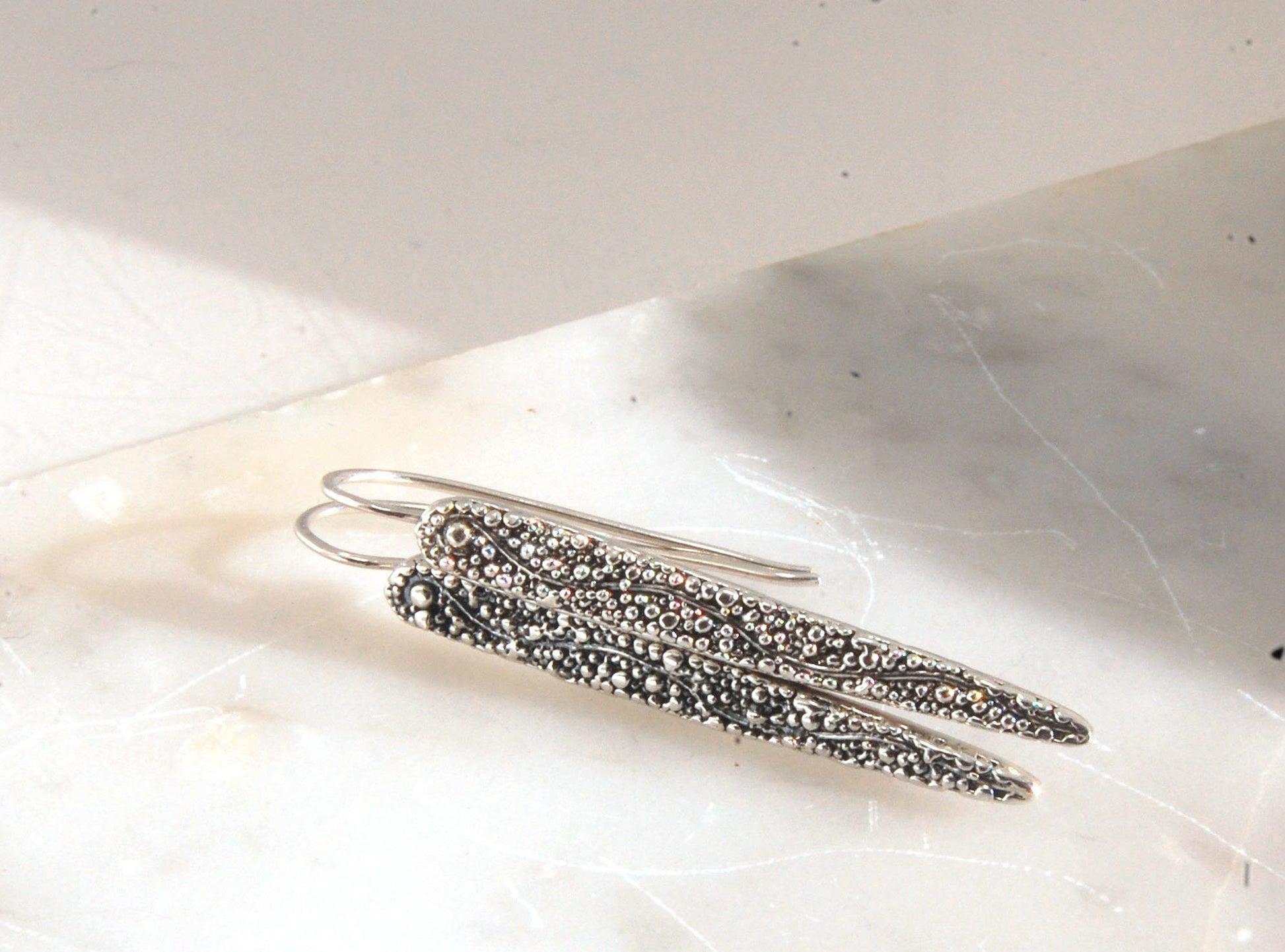 Seaweed Pattern Long Dagger French Hook Earrings with safety clasp Look at that sparkle! These seaweed dagger dangle earrings are long, elegant points of silver filled with a granulation pattern I call Seaweed, as it looks like it has so much movement in