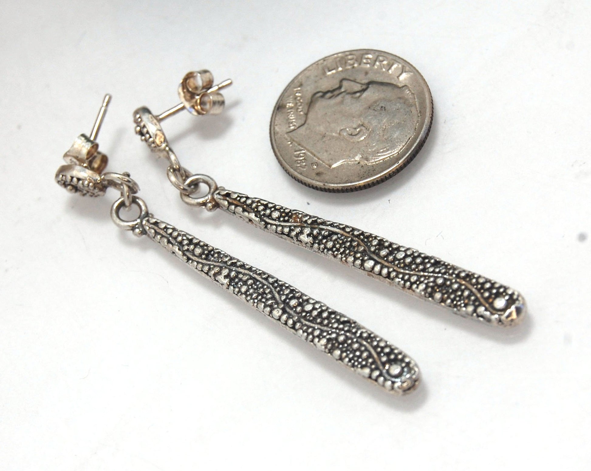 Seaweed Long Dangle Post Earrings These seaweed Post dangle earrings are cast versions of my original granulation work. Once the original work is made using the ancient technique of granulation, it is then molded for repeat waxes and then cast using the L