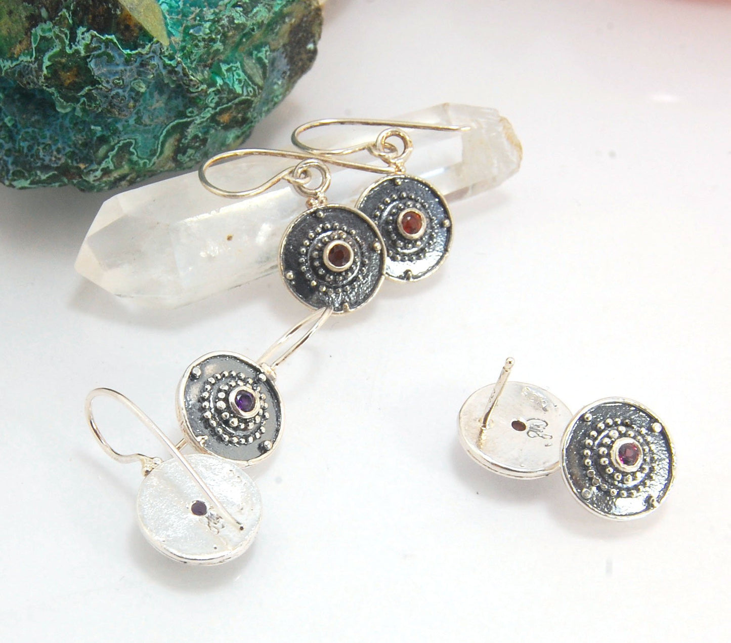 Dangle Shield Earrings in Sterling with Pink Garnet, Red Garnet, Blue Topaz, Peridot, or Amethyst These terrific shield earrings are cast from a granulated original. and is cast using the lost wax process. You can choose which stone to set in your sterlin