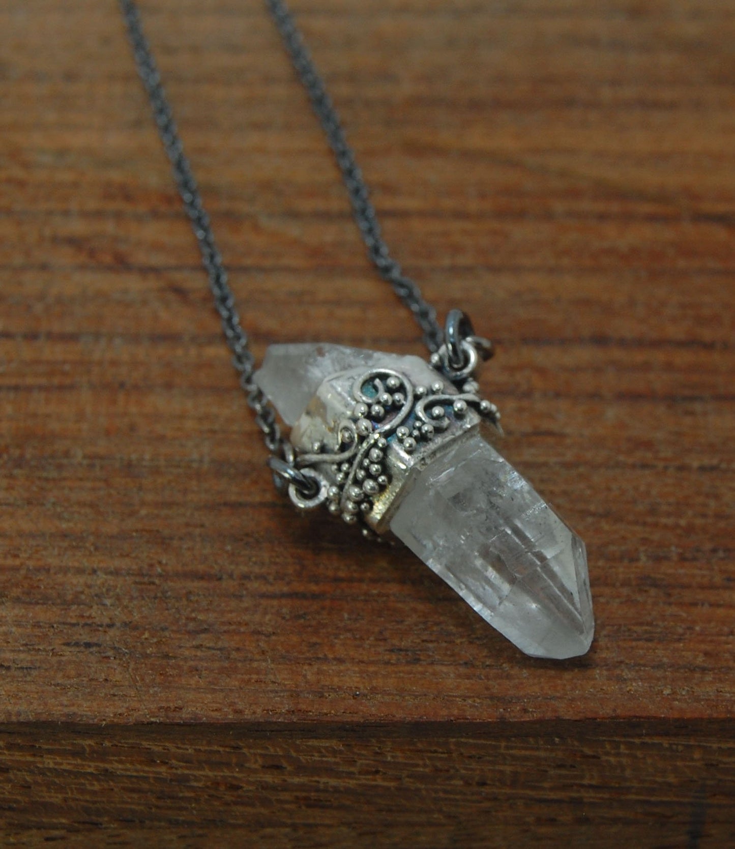 Slant Top Lemurian Quartz Crystal Necklace with Fine Silver granulated girdle I love making these crystal pendants. The silver girdle is hand shaped in fine silver to fit this specific crystal and then is granulated with fine silver wires and granules. Gr