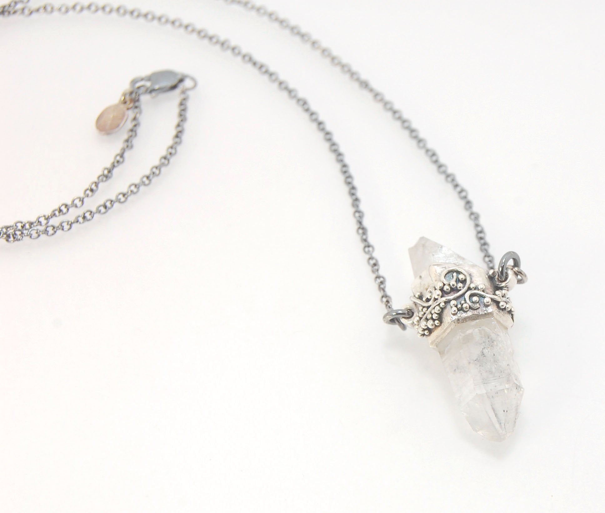 Slant Top Lemurian Quartz Crystal Necklace with Fine Silver granulated girdle I love making these crystal pendants. The silver girdle is hand shaped in fine silver to fit this specific crystal and then is granulated with fine silver wires and granules. Gr
