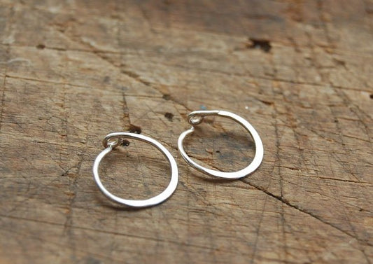 Hammered Hoops - Sterling - Small, Medium and Large Looking for an affordable handmade gift? Or some super lightweight Sterling Silver Hoops you can live in? These classic wire hammered hoops you can sleep and live in are forged from 20 gage Sterling wire