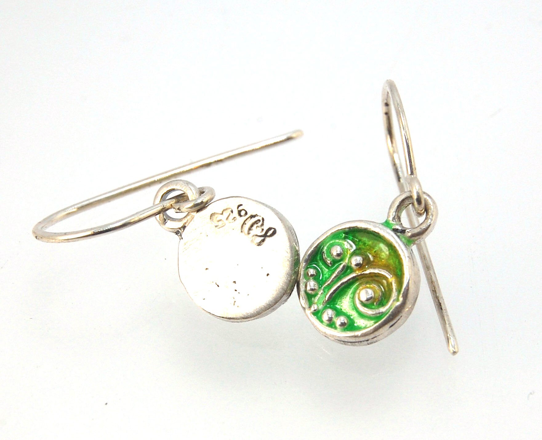 Enameled Sterling Fern Earrings -Circle -Small These are my smallest fern circles and they can be enameled in 8 colors for you!Prussian Blue, Icy Blue, Turquoise, Oil Gray, Forest Green, Jade Green, Sage Green or Periwinkle BlueGreen.These enameled 11mm o