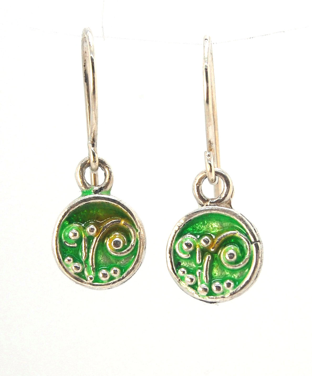 Enameled Sterling Fern Earrings -Circle -Small These are my smallest fern circles and they can be enameled in 8 colors for you!Prussian Blue, Icy Blue, Turquoise, Oil Gray, Forest Green, Jade Green, Sage Green or Periwinkle BlueGreen.These enameled 11mm o