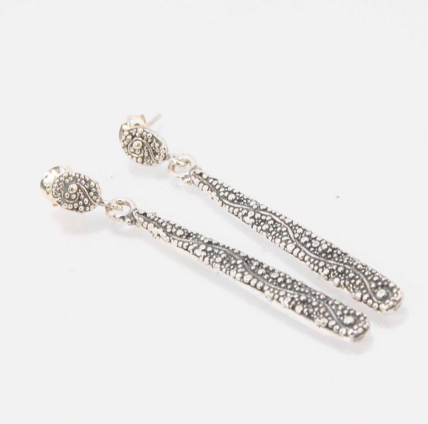 Seaweed Long Dangle Post Earrings These seaweed Post dangle earrings are cast versions of my original granulation work. Once the original work is made using the ancient technique of granulation, it is then molded for repeat waxes and then cast using the L
