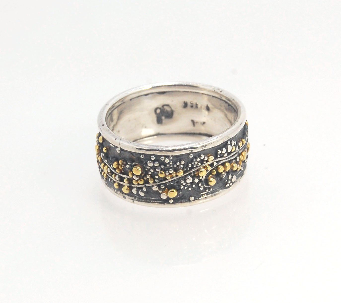 Cosmic Waves 18k and Fine Silver Granulation Ring 11mm wide This is very similar to the ring I made during the segment of “A Craftsman’s Legacy” on PBS a few years ago but with 18k gold granules of varying sizes. I am happy to make one for you in your siz