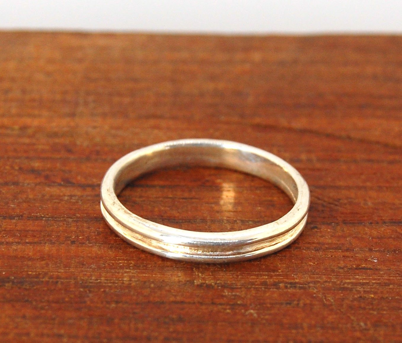 2 Rim 3.3mm Wide Band in Sterling silver Let me make a ring for you!This is a 2 rim band, 3.3 mm wide cast from a wax carving turned on a lathe and cast using the process of lost wax. These are so much fun to make and I have several variations of differen