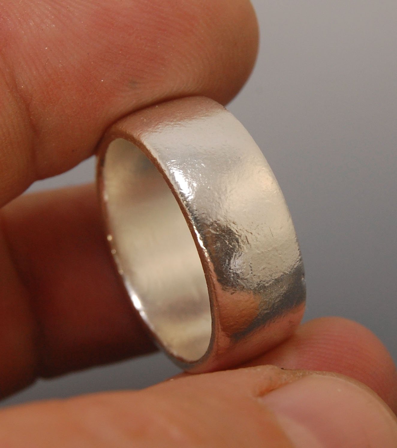 Real Wide Flat Half Round Band Ring in Sterling Silver This is a Real Wide Flat Half Round Band Ring cast from a wax carving. 8mm wide and 2.5mm thick, this ring was turned on a lathe in wax and cast using the lost wax process. These are so much fun to ma