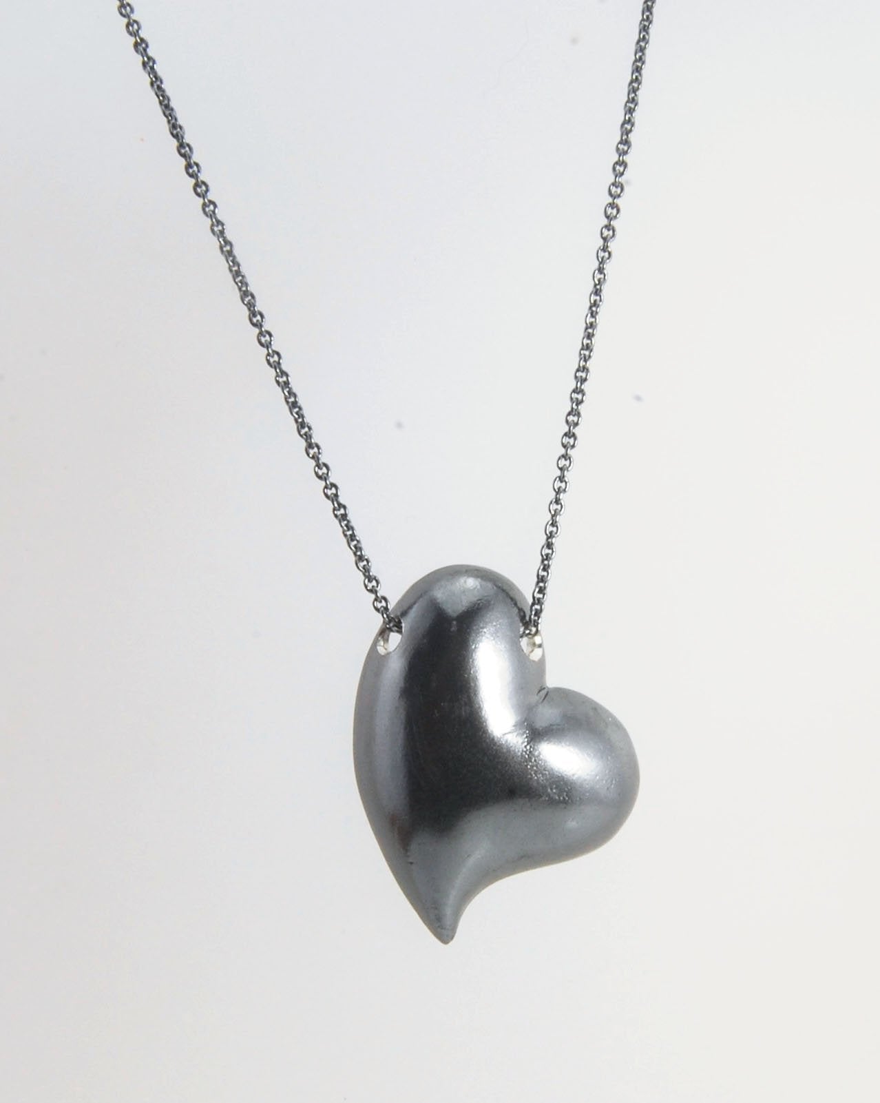 Witch Heart Slider Pendant Necklace This Witch Heart Slider Pendant Necklace in Sterling Silver is a heavy, hollow, silver form I made by wax carving and casting this pendant.The heart shape is called a Witch Heart. Over time, Witch Hearts have symbolized