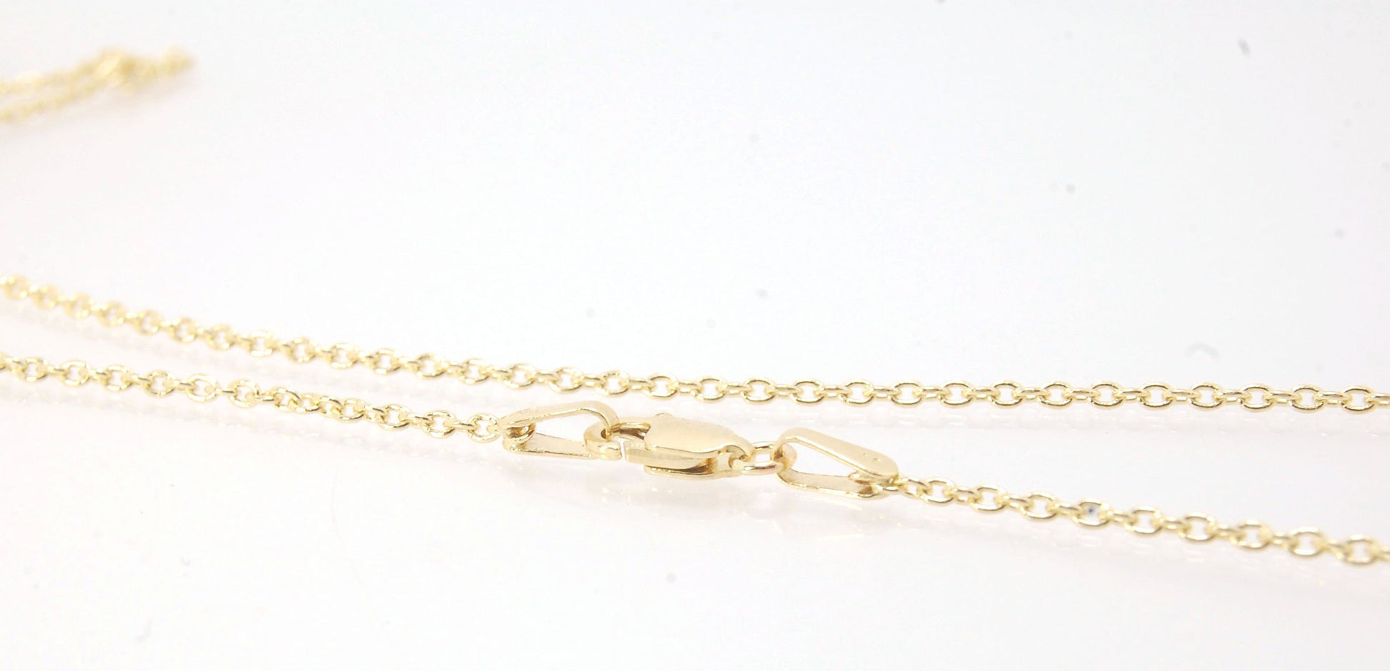 1.45mm 14k yellow gold cable chain with Lobster Clasp - 16", 18", 20" or 24" This lovely finished chain is the Goldilocks of chains. Not too big and not too small with a secure make and classic but understated design to compliment your handmade pendant. T