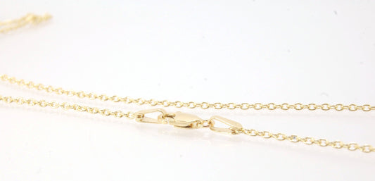 1.5mm 18k yellow gold cable chain with Lobster Clasp - 16", 18", or 20" This lovely finished chain is the Goldilocks of chains. Not too big and not too small with a secure make and classic but understated design to compliment your handmade pendant.This ch