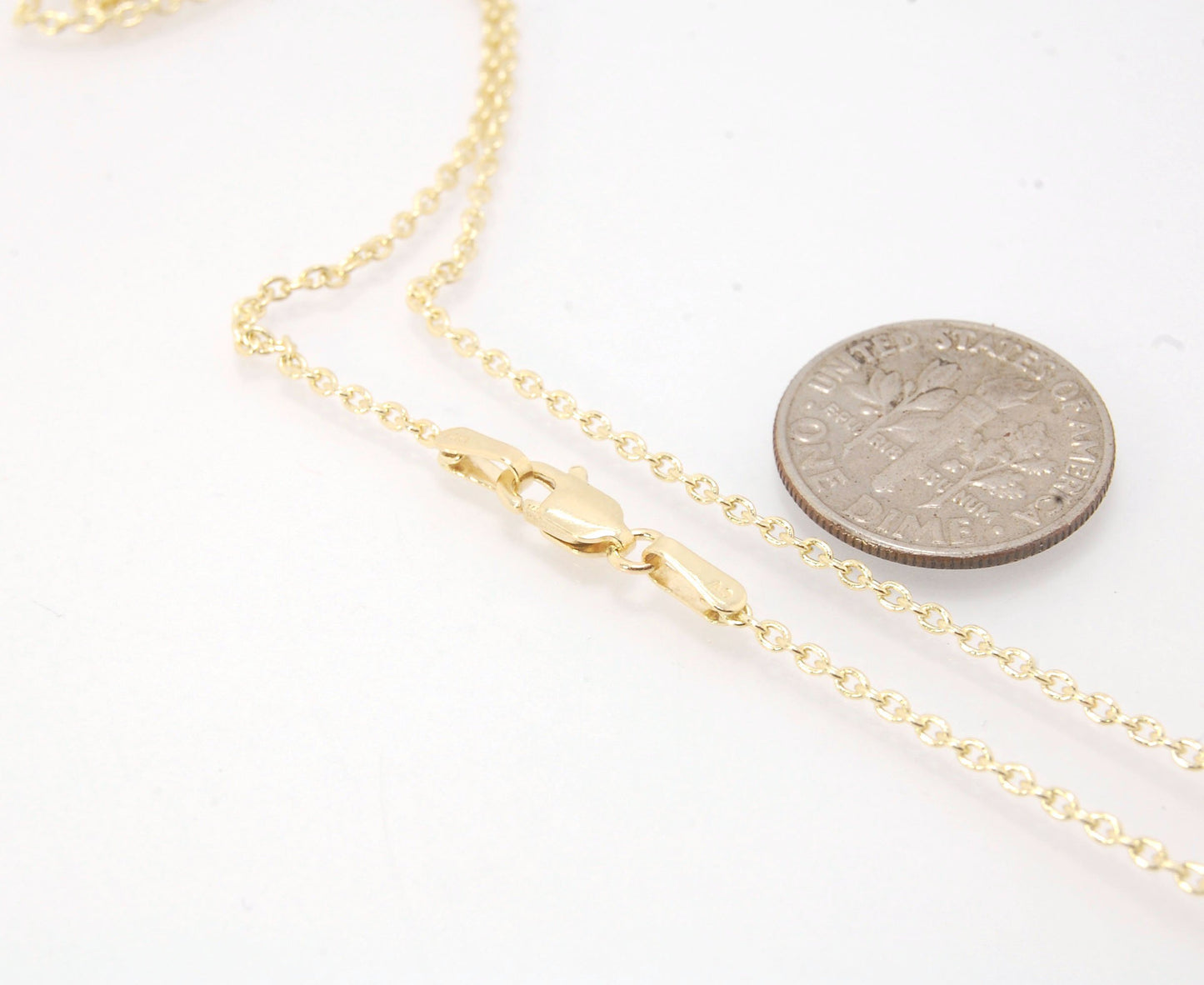 1.45mm 14k yellow gold cable chain with Lobster Clasp - 16", 18", 20" or 24" This lovely finished chain is the Goldilocks of chains. Not too big and not too small with a secure make and classic but understated design to compliment your handmade pendant. T