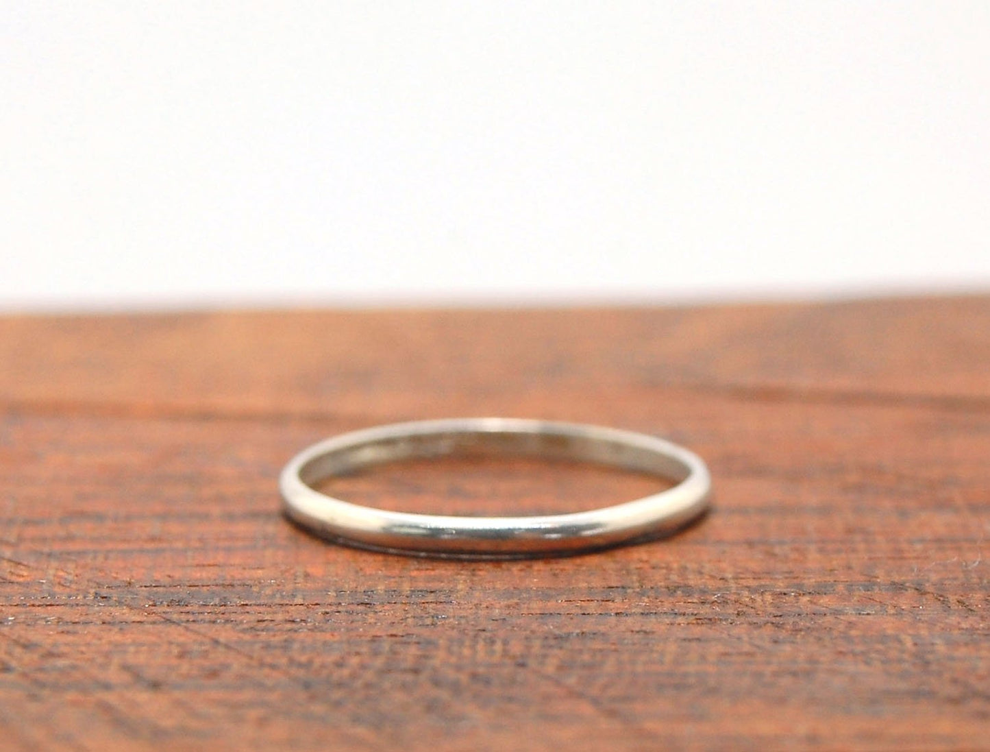 Thin Half Round Plain Band - 1.8mm wide x 1mm thick in Gold or Silver Let me make you a ring!This half round plain band is milled in my studio and hand finished to your specifications in the metal of your choice.This half round band ring is pictured in st