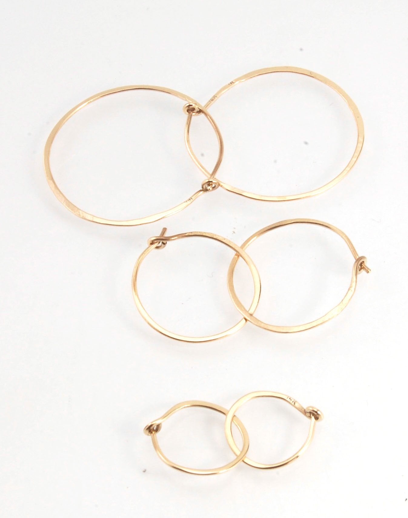 Hammered 14k Hoops - Small, Medium and Large These are exactly the same as my hammered sterling hoops, but they are made of solid 14k gold! They are super lightweight, classic wire hammered hoops you can sleep and live in. These delicate hoops are forged