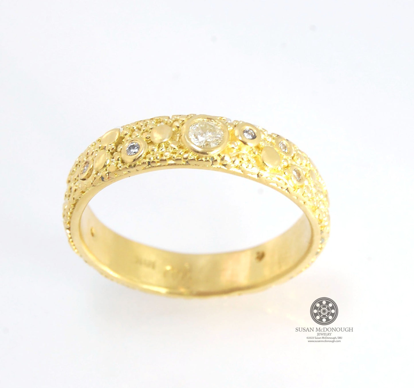 Balance and Flow Band 18k Granulation with 9 Diamonds - Made to Order This is a one-of-a-kind 18k gold and Diamond band made special just for you! The pattern is a balance of twining lines and granules and slices of cylinder ingots to make settings for ni