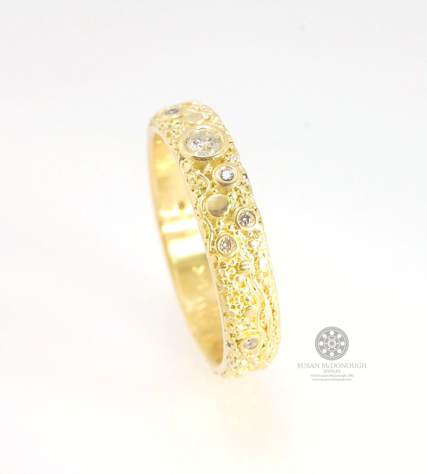 Balance and Flow Band 18k Granulation with 9 Diamonds - Made to Order This is a one-of-a-kind 18k gold and Diamond band made special just for you! The pattern is a balance of twining lines and granules and slices of cylinder ingots to make settings for ni