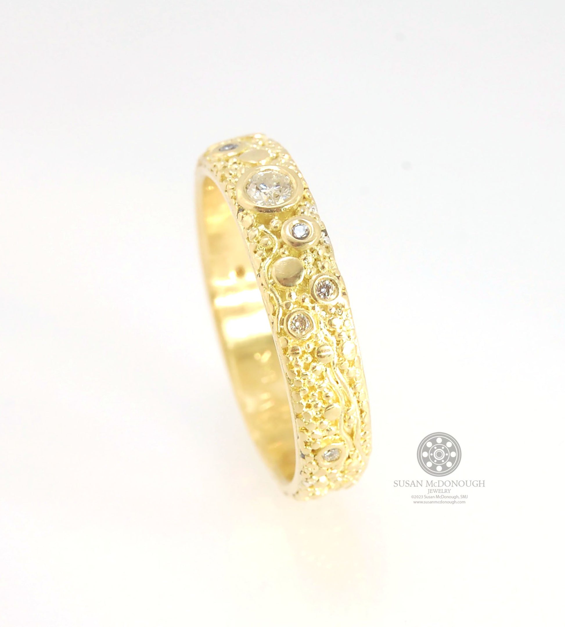 Balance and Flow Band 18k Granulation with 9 Diamonds - Made to Order This is a one-of-a-kind 18k gold and Diamond band made special just for you! The pattern is a balance of twining lines and granules and slices of cylinder ingots to make settings for ni