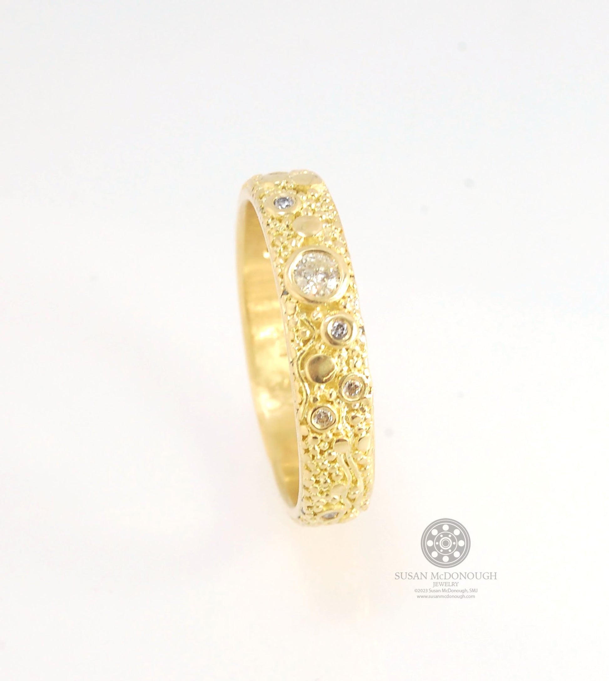 Balance and Flow Band 18k Granulation with 9 Diamonds - Made to Order This is a one-of-a-kind 18k gold and Diamond band made special just for you! The pattern is a balance of twining lines and granules and slices of cylinder ingots to make settings for ni