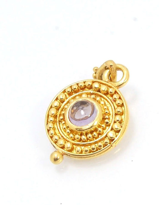 Amethyst 18k Gold Granulation Medallion This lovely light amethyst cabochon is surrounded by the 18k gold bezel setting and 18k gold granulation with a notched granulated bail. This classically inspired medallion looks like it could have come from buried