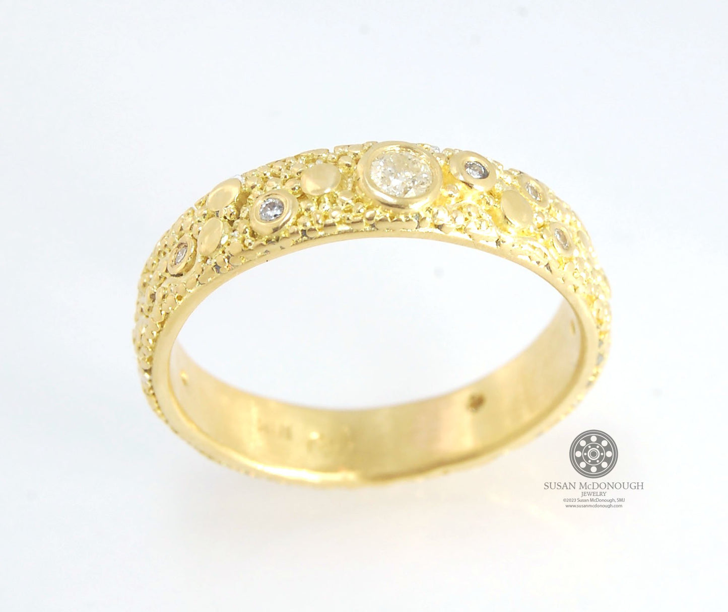 Balance and Flow Band 18k Granulation with 9 Diamonds - Made to Order This is a one-of-a-kind 18k gold and Diamond band made special just for you! The pattern is a balance of twining lines and granules and slices of cylinder ingots to make settings for ni