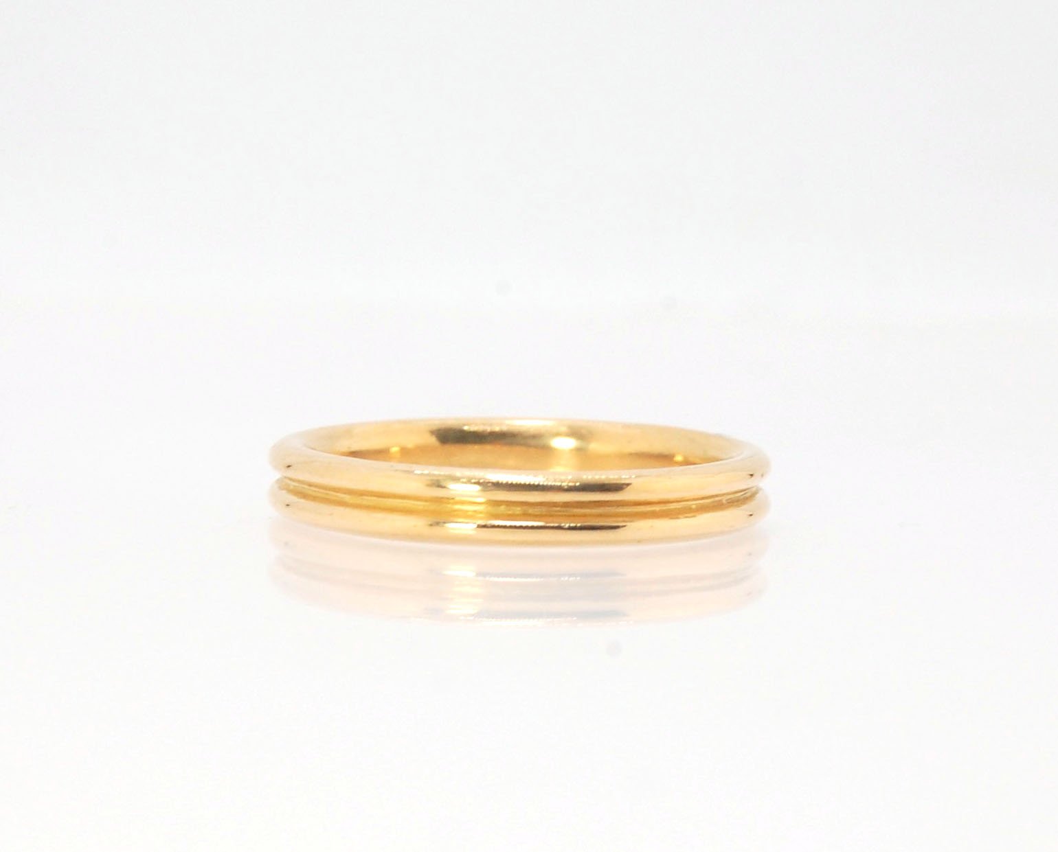 2 Rim 3.3mm Wide Band - Sterling silver, 14k or 18k yellow gold This is a narrow, 3.3mm, 2 rim band cast from a wax carving turned on a lathe. These are so much fun to make and I have several variations of different rims and widths available. I then take