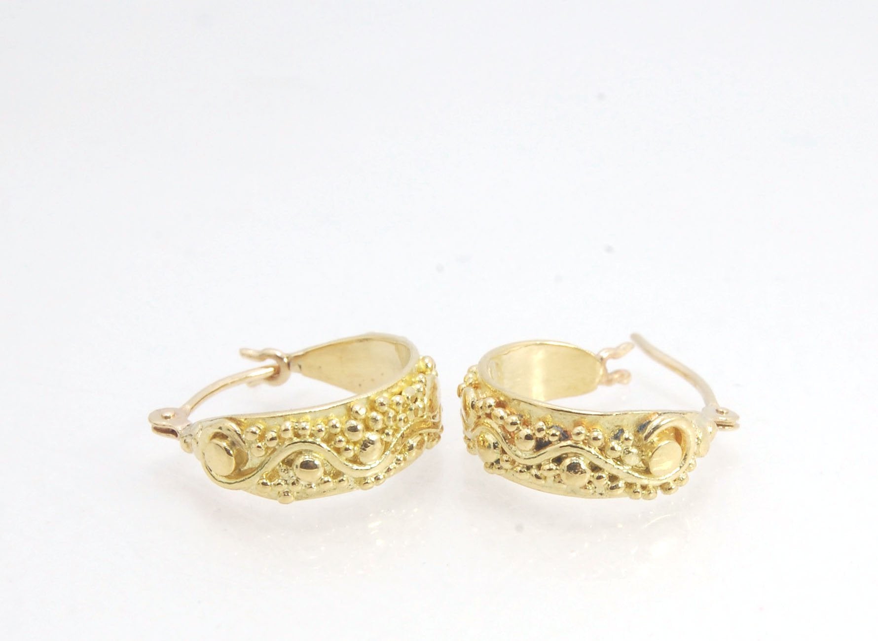 18k Green Gold Starry Night Hoops These are super sweet one of a kind granulated hoops in small batch alloyed Green 18k Gold Granulation. They are a perfect size to wear all the time! The granulation pattern has an undulating line with large and small gra