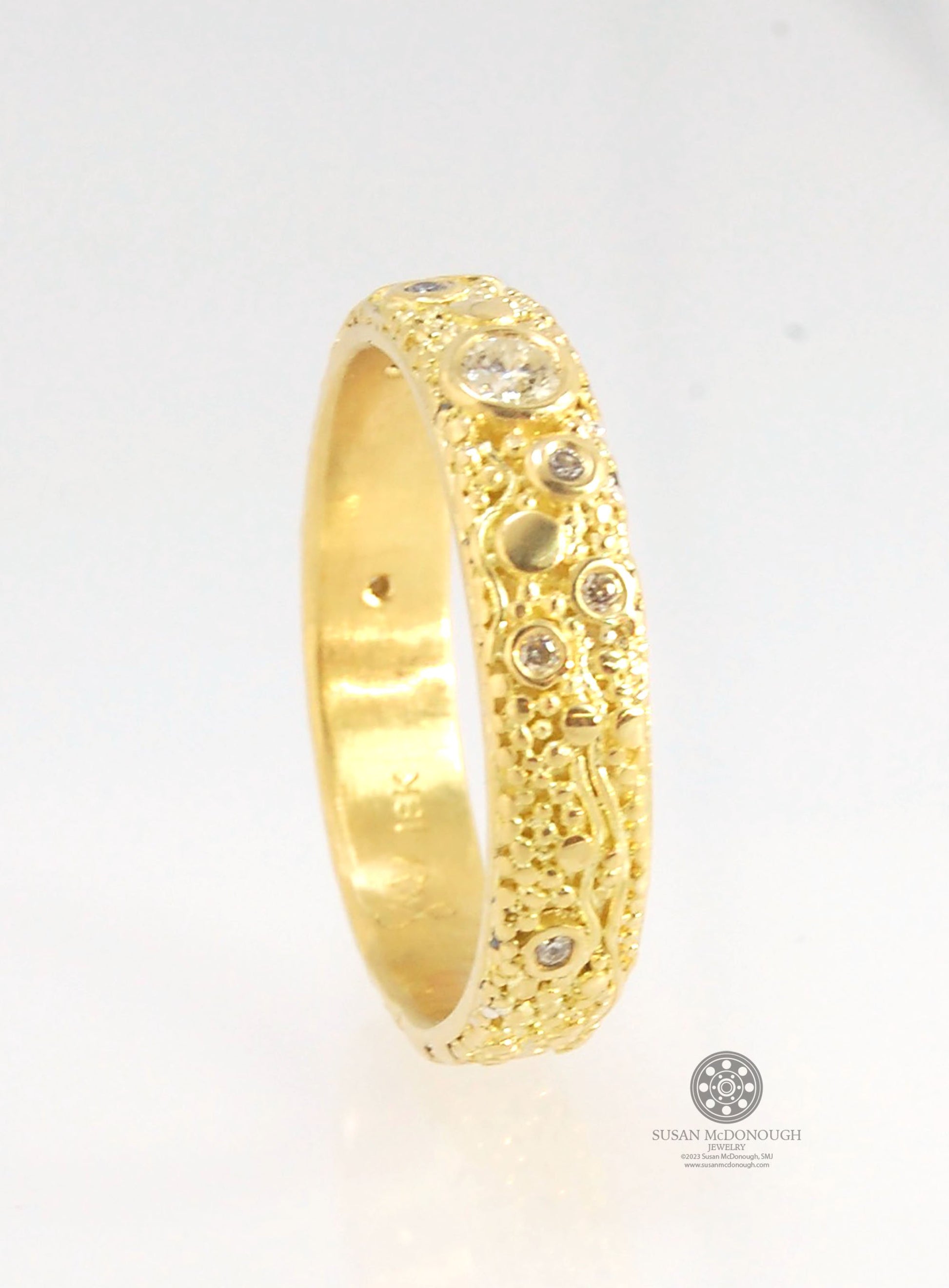 Balance and Flow Band 18k Granulation with 9 Diamonds - Made to Order This is a one-of-a-kind 18k gold and Diamond band made special just for you! The pattern is a balance of twining lines and granules and slices of cylinder ingots to make settings for ni