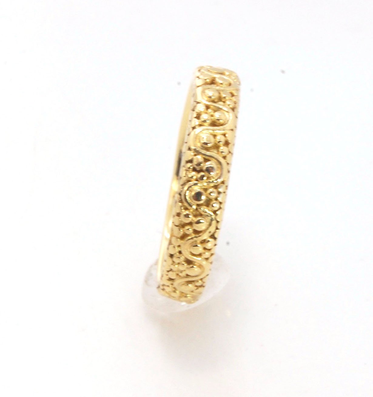 Squiggle and Dot Granulated Ring in Fine Silver or 18k Gold This lovely Squiggle and Dot design band is unique and made by hand using the ancient process of Granulation. Granulation is a controlled fusing process utilized for thousands of years which can