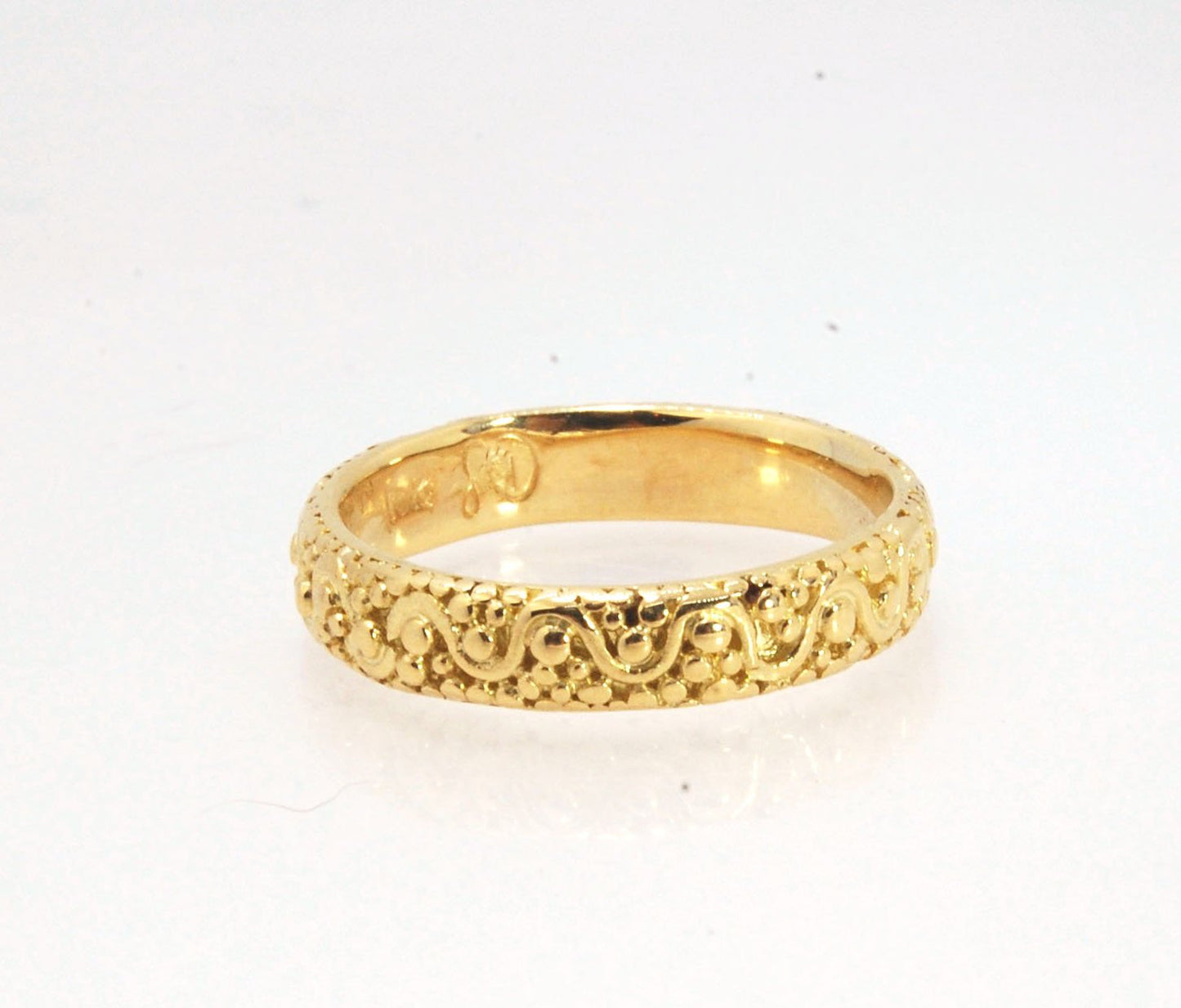 Squiggle and Dot Granulated Ring in Fine Silver or 18k Gold This lovely Squiggle and Dot design band is unique and made by hand using the ancient process of Granulation. Granulation is a controlled fusing process utilized for thousands of years which can