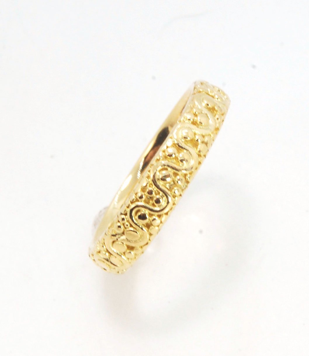 Squiggle and Dot Granulated Ring in Fine Silver or 18k Gold This lovely Squiggle and Dot design band is unique and made by hand using the ancient process of Granulation. Granulation is a controlled fusing process utilized for thousands of years which can