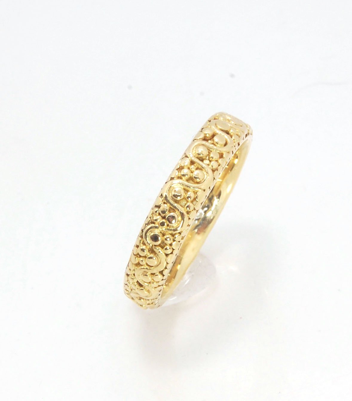 Squiggle and Dot Granulated Ring in Fine Silver or 18k Gold This lovely Squiggle and Dot design band is unique and made by hand using the ancient process of Granulation. Granulation is a controlled fusing process utilized for thousands of years which can