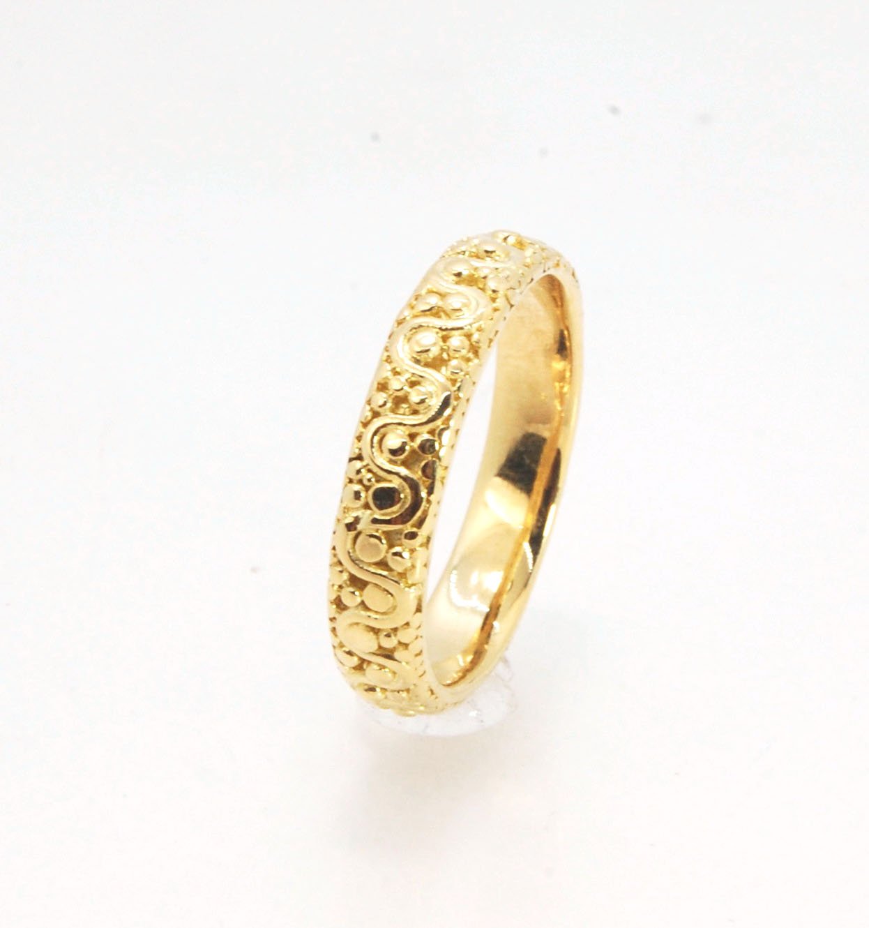 Squiggle and Dot Granulated Ring in Fine Silver or 18k Gold This lovely Squiggle and Dot design band is unique and made by hand using the ancient process of Granulation. Granulation is a controlled fusing process utilized for thousands of years which can