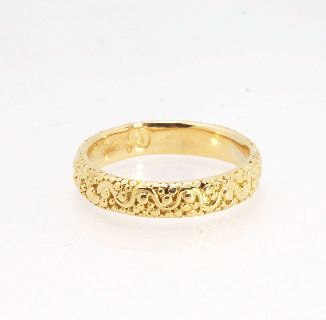 Squiggle and Dot Granulated Ring in Fine Silver or 18k Gold This lovely Squiggle and Dot design band is unique and made by hand using the ancient process of Granulation. Granulation is a controlled fusing process utilized for thousands of years which can