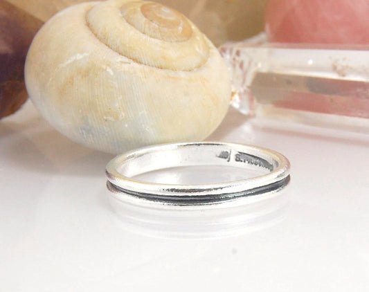 2 Rim 3.3mm Wide Band in Sterling silver Let me make a ring for you!This is a 2 rim band, 3.3 mm wide cast from a wax carving turned on a lathe and cast using the process of lost wax. These are so much fun to make and I have several variations of differen