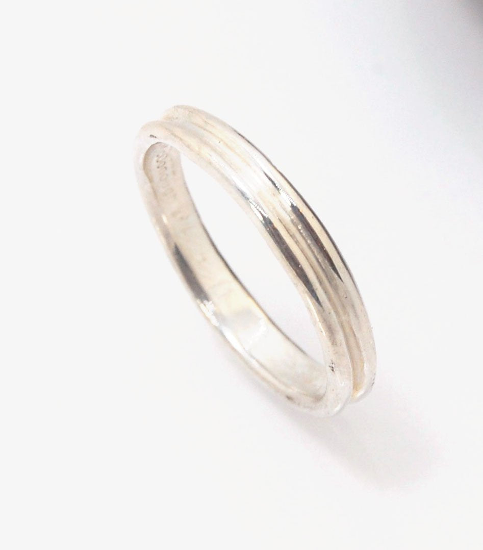 2 Rim 3.3mm Wide Band - Sterling silver, 14k or 18k yellow gold This is a narrow, 3.3mm, 2 rim band cast from a wax carving turned on a lathe. These are so much fun to make and I have several variations of different rims and widths available. I then take