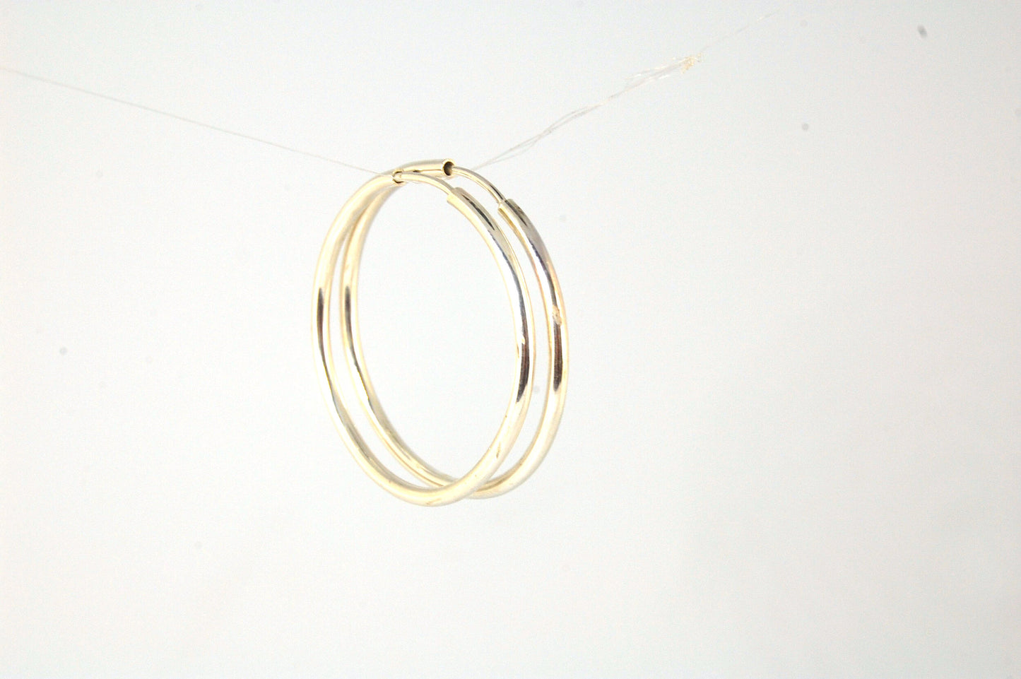 Sterling Eternity Hoops 1" These eternity hoop earrings are secure, lightweight and comfortable to wear everyday.These hoops are 30mm (approx. 1”)Sterling SilverMADE TO ORDER - Ships in 3-10 days