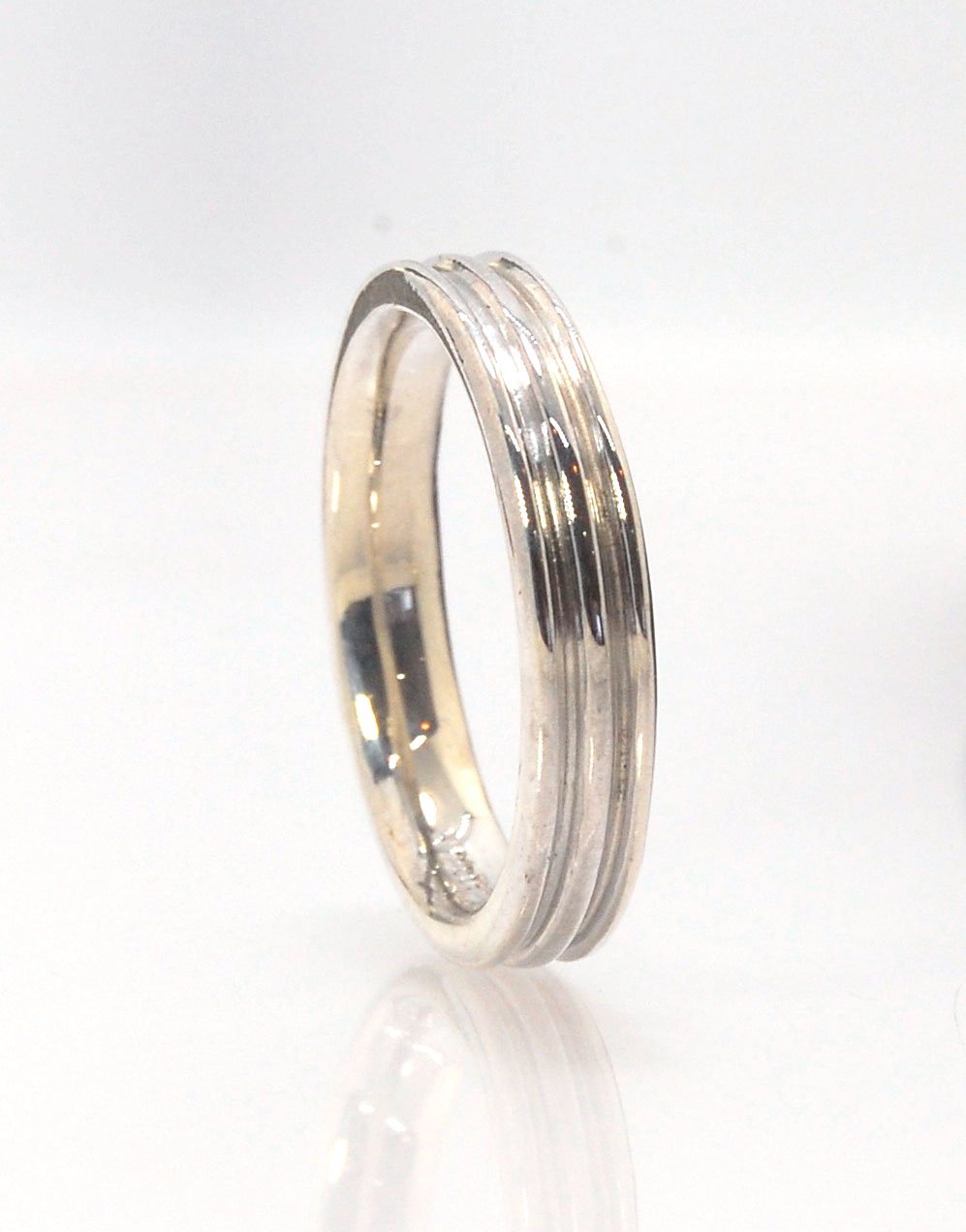 3 Rim 4.3 wide band - Sterling silver, 14k or 18k yellow gold This is a narrow 3 rim band cast from a wax carving turned on a lathe and then cast in the metal of your choice using the lost wax process. These are so much fun to make and I have several vari