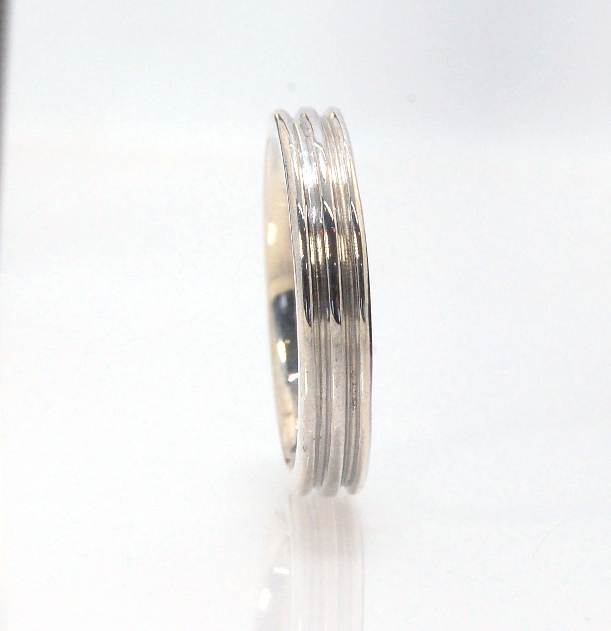 3 Rim 4.3 wide band - Sterling silver, 14k or 18k yellow gold This is a narrow 3 rim band cast from a wax carving turned on a lathe and then cast in the metal of your choice using the lost wax process. These are so much fun to make and I have several vari