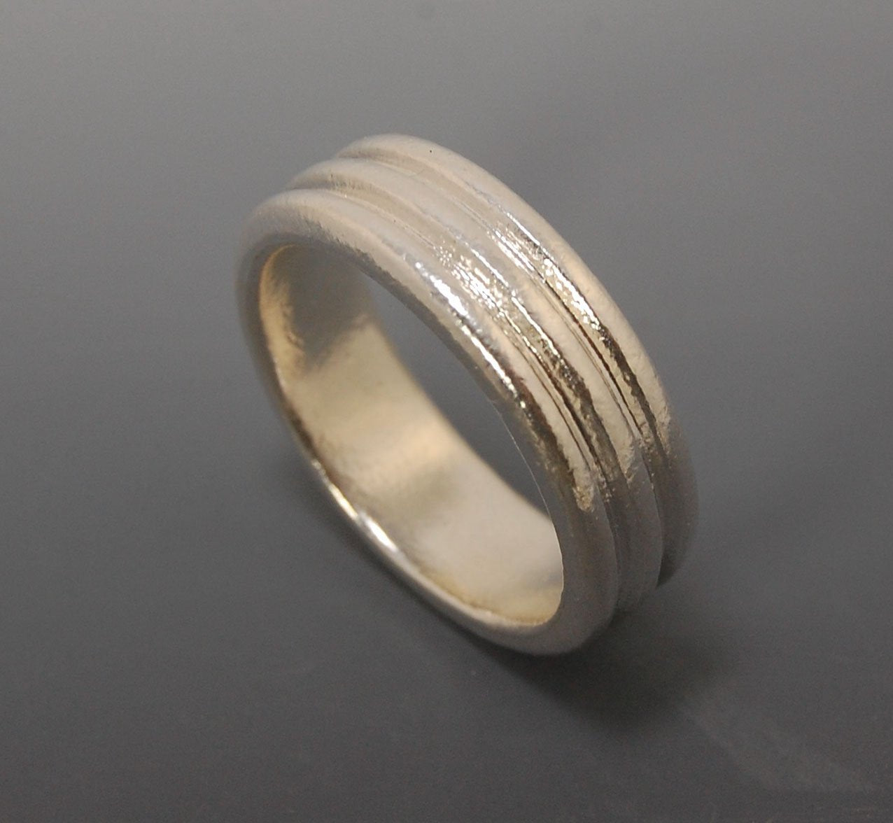 3 Rim Band -6.2mm wide - Sterling silver, 14k or 18k yellow gold This is a 3 rim band cast from a wax carving turned on a lathe and cast using the lost wax process. These are so much fun to make and I have several variations of different rims and widths a