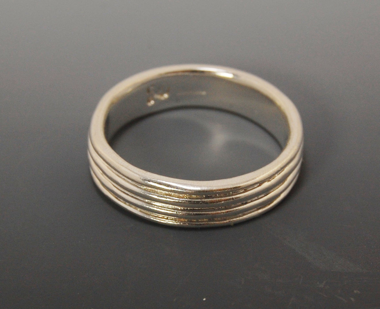 4 Rim Heavy Band 6mm wide - in Gold or Silver This is a heavy band cast from a wax carving turned on a lathe. These are so much fun to make! I have several different variations of this design.6mm wide and 2 mm thickThis ring is pictured in sterling silver